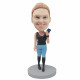 female in black vest and holding a cell phone custom figure bobblehead
