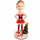 female in christmas dress hands on hips with christmas tree custom figure bobbleheads
