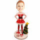 female in christmas dress hands on hips with christmas tree custom figure bobbleheads female in christmas dress hands on hips with christmas tree custom figure bobbleheads