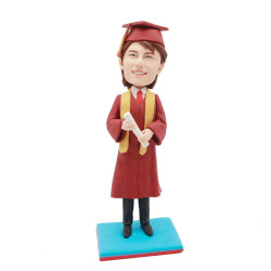 male graduates in red gown and yellow ribbon custom graduation bobblehead