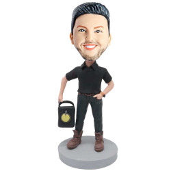male in black t-shirt and carrying a stereo custom figure bobblehead