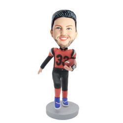 male rugby player in professional sportswear holding rugby custom figure bobblehead